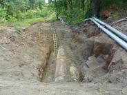 Old sewer line uncovered in preparation for replacement of 30-inch line behind Old Portland Road 
