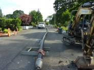 Pipe prepared to replace old concrete sewer line using trenchless method on Cedaroak Street 